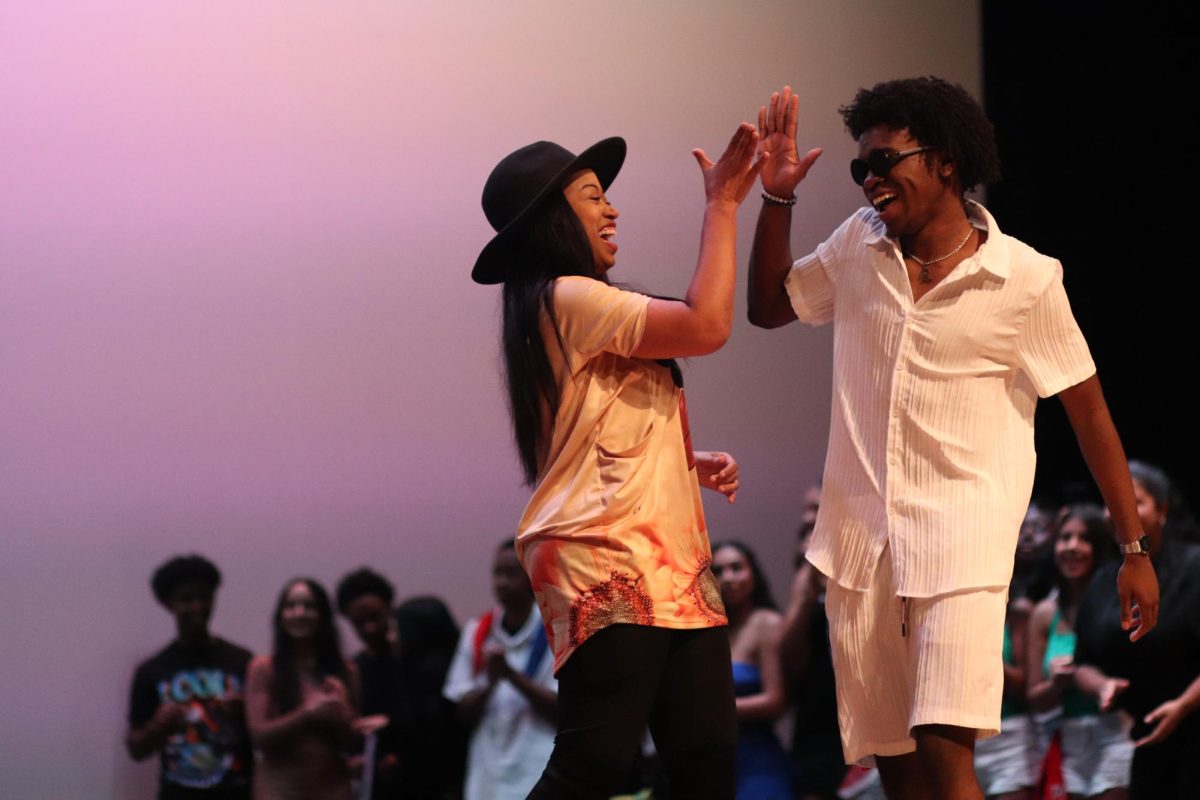 Wrapping It Up. Math teacher Alexandria Mighty and senior Ronel Chery celebrate the end of the BSU Black History Month show dancing in the soul train. 