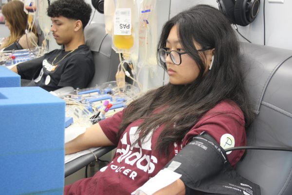 Senior Karen Liu listens to music through her AirPods as she got her blood drawn. This blood drive happened on April.18 in the morning, and was being held by the JROTC.  “I believe that my blood donation can possibly save someone’s life one day, senior Karen Liu said.