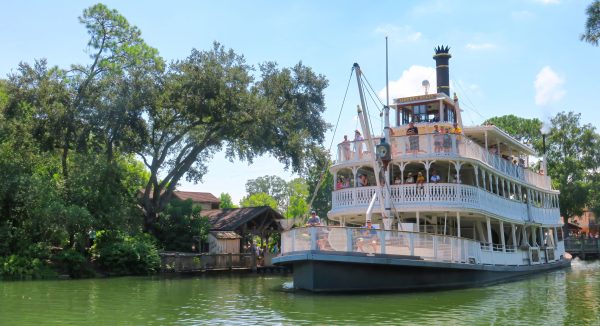 The riverboat Liberty Belle sailing on the Rivers of America passes Tom Sawyer Island at the Magic Kingdom in Walt Disney World on Aug. 15, 2024. Disney has announced that the island and surrounding river —that have operated since 1973 as a Mark Twain-inspired attraction— will become two new rides based on the “Cars” movie franchise as part of a major reimagining of the Frontierland area of the park. Photo permission from Joe Burbank/Orlando Sentinel/TNS.