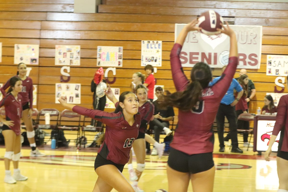 Opposite hitter Mia Espino (13) gets ready to spike the ball at the senior night game on Monday, Sept. 30 against Flanagan High School. The game ended in a final score of 3-0, making it their sixth win of the season.