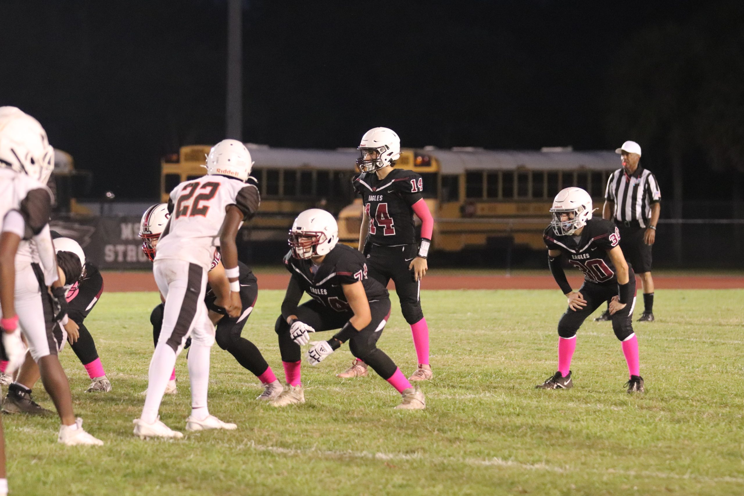 Quarterback Sampsen Orlinsky (14) leads his offense during the fourth quarter against the Bengals at Cumber Stadium on Wednesday, Oct. 16. The JV Eagles won their second game of the season, defeating the Bengals 13-8.