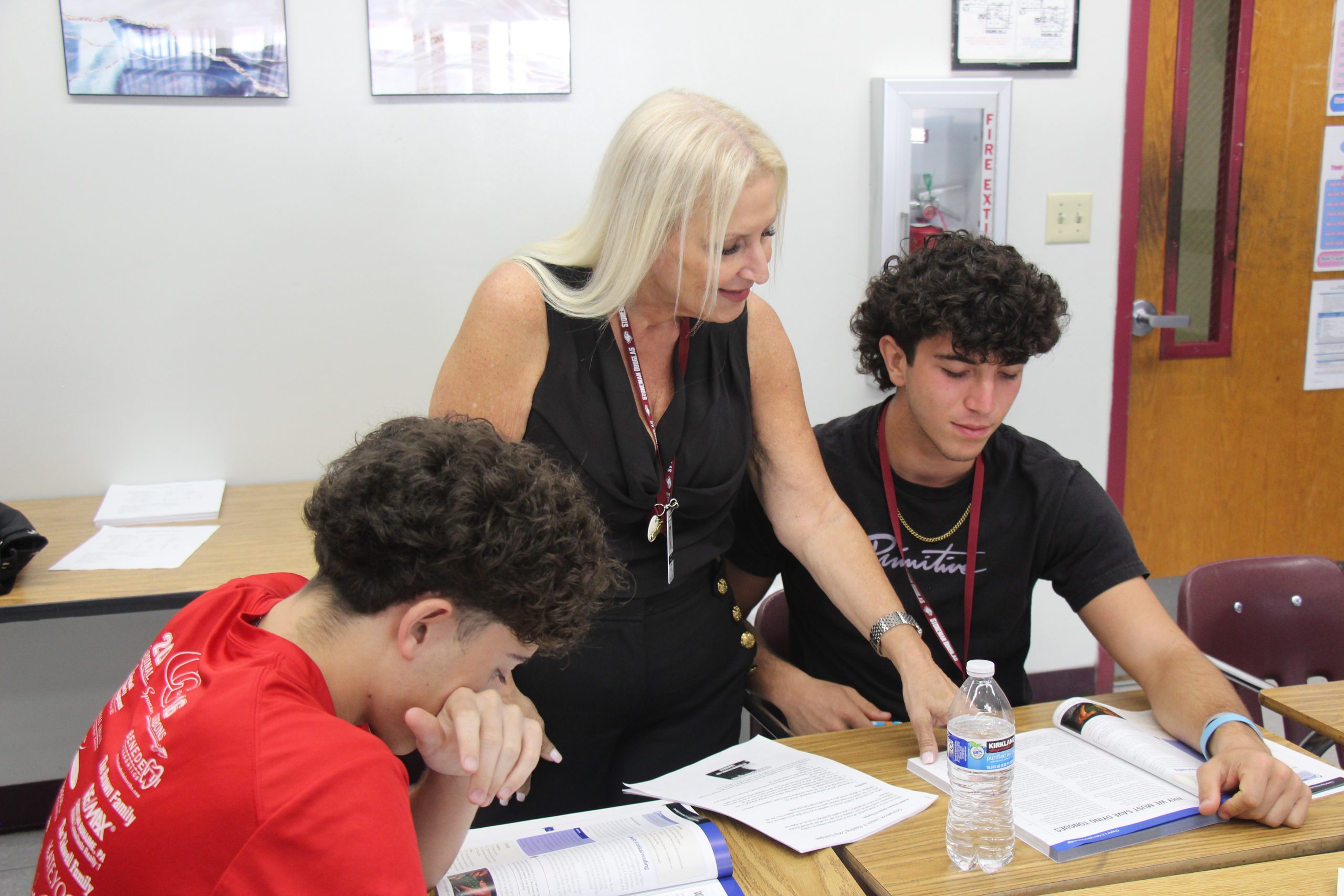 AICE General Paper teacher Cynthia Beach helps seniors Thomas Zanatta and Shayne Shapario with a classroom assignment. This year is Beach's third year teaching at MSD, but she has taught a variety of courses at other schools during her 14-year teaching career.