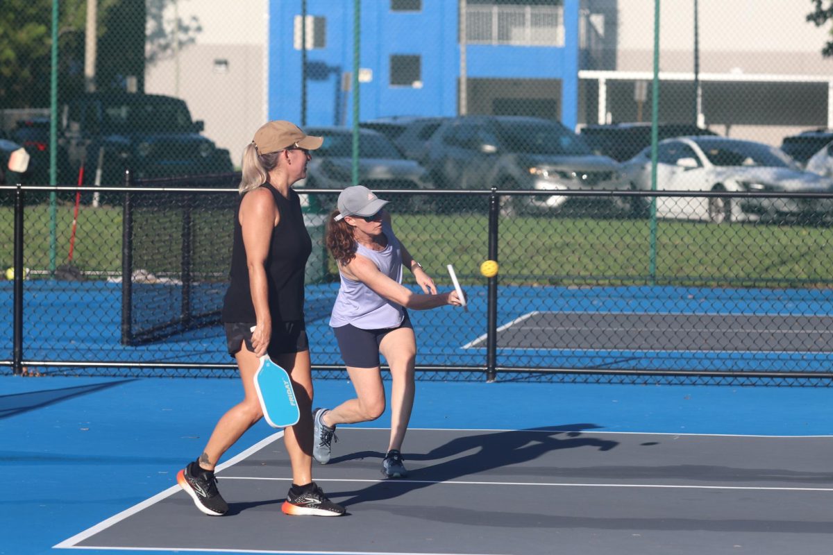 One point at a time. English teacher Holly Van Tassel and Physical Education teacher Elisa Williamson team up in a game of two-on-two pickleball. The game took place on Sunday, Sept. 29 against and allowed the teachers to unwind and have some fun before the long school week ahead. “Herzfeld reached out to few people who lived close by together and she taught us to play,” Van Tassel said. “We planned to play weekly from the start, and we all enjoyed it, so we continued.”One point at a time. English teacher Holly Van Tassel and Physical Education teacher Elisa Williamson team up in a game of two-on-two pickleball. The game took place on Sunday, Sept. 29 against and allowed the teachers to unwind and have some fun before the long school week ahead. “Herzfeld reached out to few people who lived close by together and she taught us to play,” Van Tassel said. “We planned to play weekly from the start, and we all enjoyed it, so we continued.”