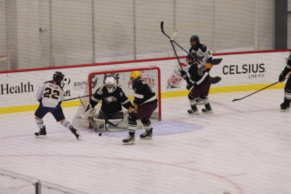 Goalie Brandon Trokey (1) blocks the puck shot from Cypress Bay High School. This was the first game and win of the season with a score of 5-0 against Cypress Bay High School on Sunday, Oct. 27 at the FTL War Memorial.