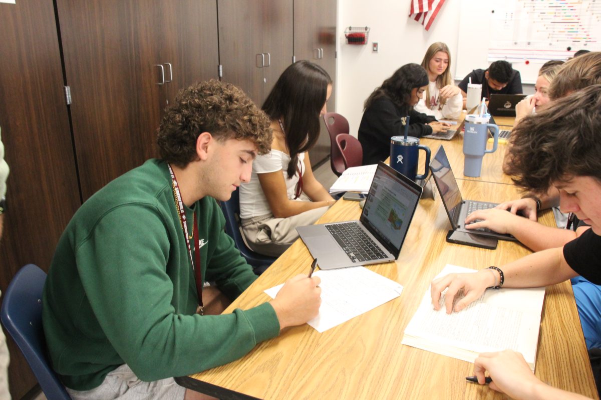 Senior Mason Sands works diligently during his AP Government class on Wednesday,  Oct. 16. Social studies classes were recorded as having the most registered voters compared to other BCPS. "I'm registered to vote so I could try to make my impact, and it's important because everybody needs their opinion heard," Sands said.