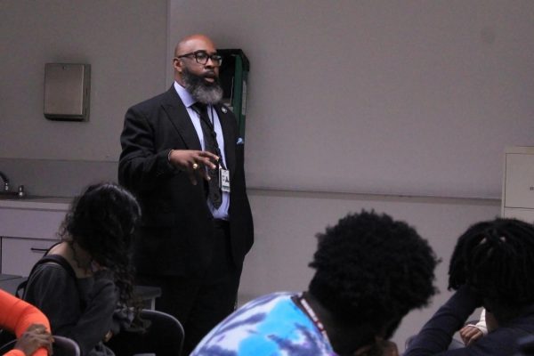 Black Student Union advisor Kelvin Lamar starts off the club's general meeting on Monday, Oct. 28. He spoke about how he visited Clark, Atlanta; The Legacy Museum, Tuskegee and the King Memorial as a part of a history field trip for seniors. "The club has been existing since 2014, I've been the advisor for the past two and a half years," Lamar said. "It's a pro-African descent type of club, we promote black pride and the contributions done by blacks all over the world. Today, we talk about historically black collages and universities, those are institutions that a lot of our students don't know exist, and about the history that they have."