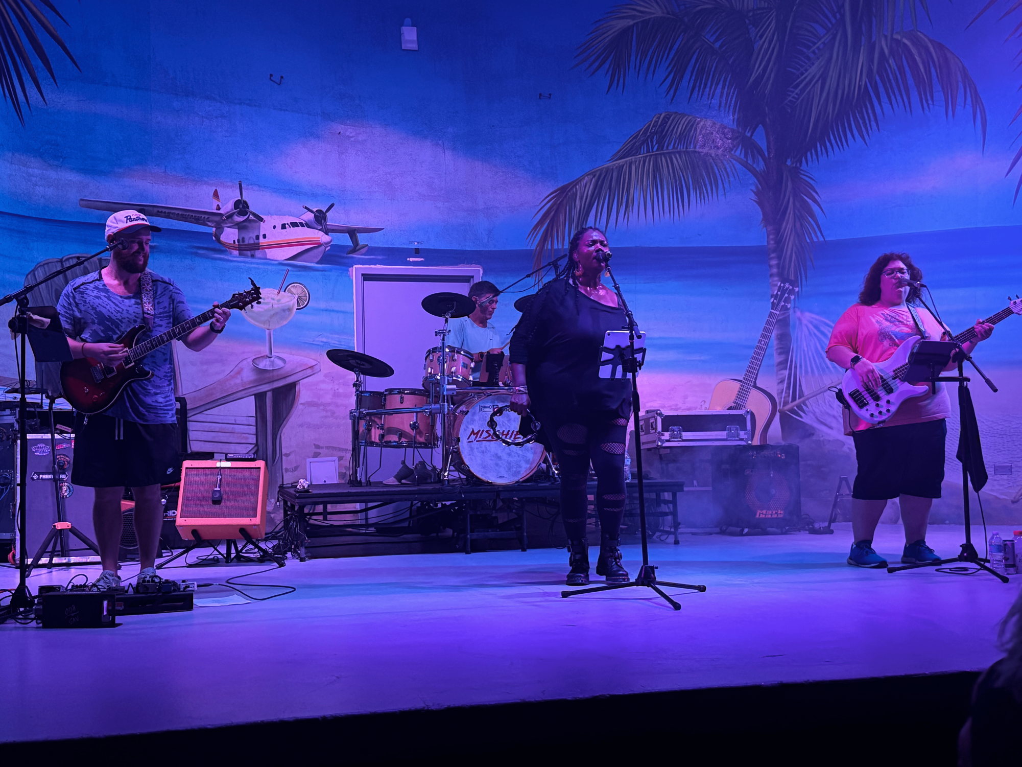 AP World History teacher Devin Schaller plays the guitar in a live performance. His coworker, guidance counselor Jerry Turmaine, is also a member of his band, "Mischief."