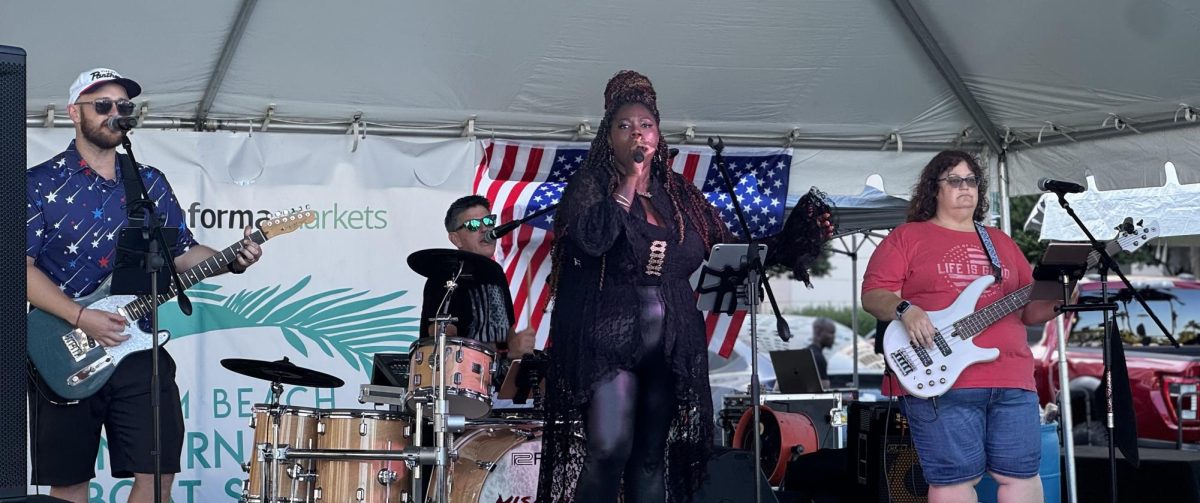 AP World History teacher Devin Schaller and guidance counselor Jerry Turmaine play a performance in South Florida. The cover band is called "Mischief."