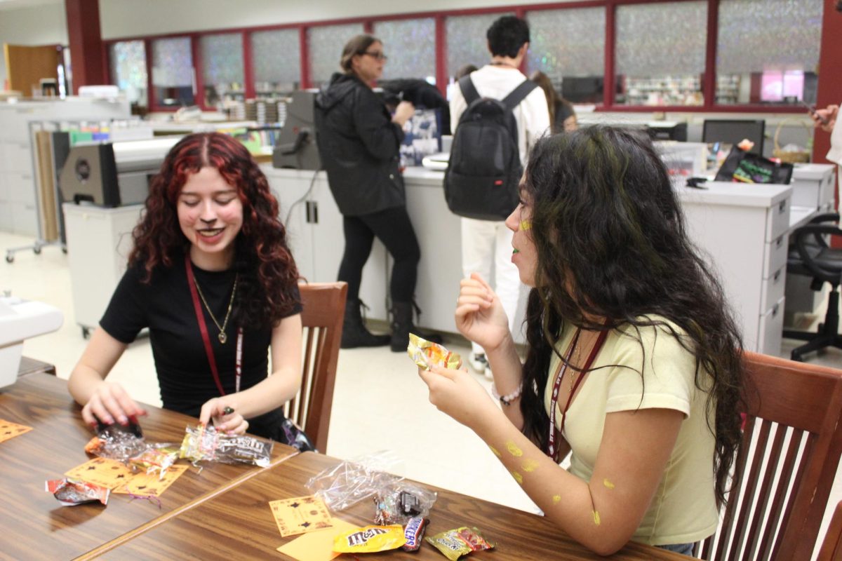 FFEA members Tabitha Memoli and Sienna Mader eat leftover Boo Grams. Boo Grams were sold during the first two weeks of October. "We really enjoyed making the boograms; it was really fun to deliver them to classrooms," Mader said.