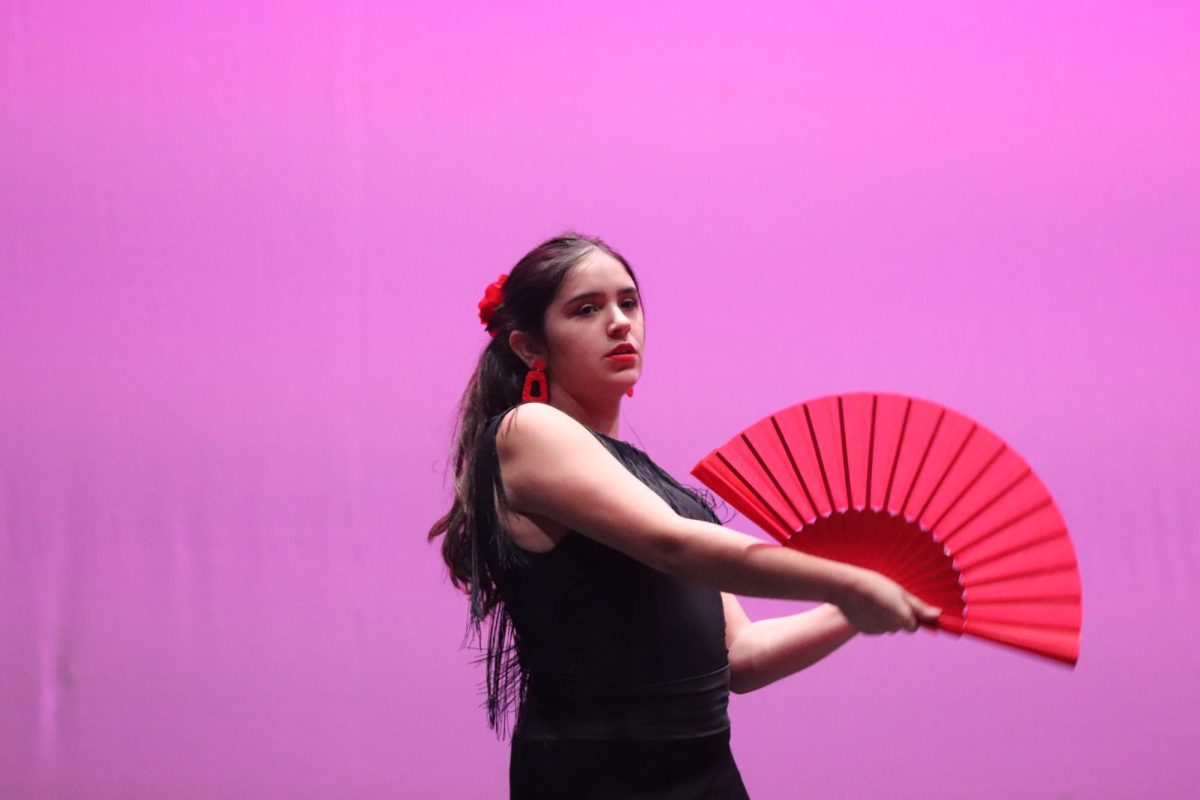 Senior Carolina Ochoa Lozano performs the flamenco dance. Ochoa Lozano was Spanish Club President and assisted with the paperwork portion of the Multicultural Show.