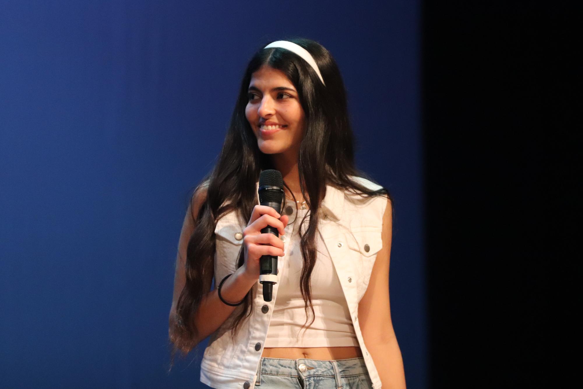 Senior Constanza Lamaison acts in between dances at the Multicultural Show. Lamaison also danced in cumbia.