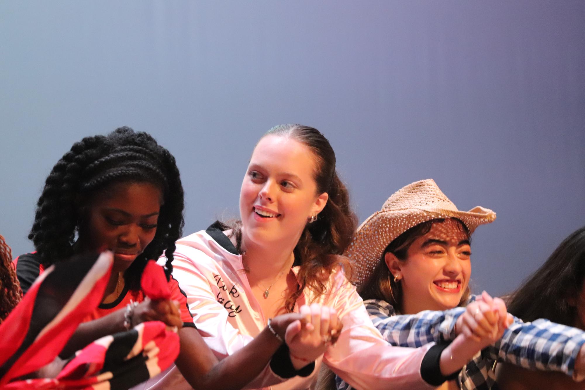 Senior Julia Iuchyk takes her bows at the end of Act 1. Iuchyk choreographed the jive dance, which was added to the Multicultural Show for the first time this year.