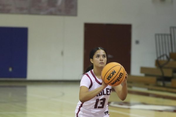 Shooting guard Gabi Pino (13) takes a free throw shot after a foul made by Piper High School. The Eagles went on to win this game 64-27 on Monday, Jan. 13.