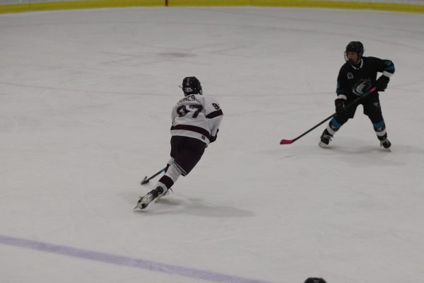 Eagles 1 Forward Brandon Jones (97) leads the offense on a break against Archbishop McCarthy High School on Monday, Dec. 16 at the Panthers Ice Den. The Eagles defeated the Mavericks 4-3. "The team played a super defense game and well structured. Also played smart and hard," forward Von Seys (28) said.