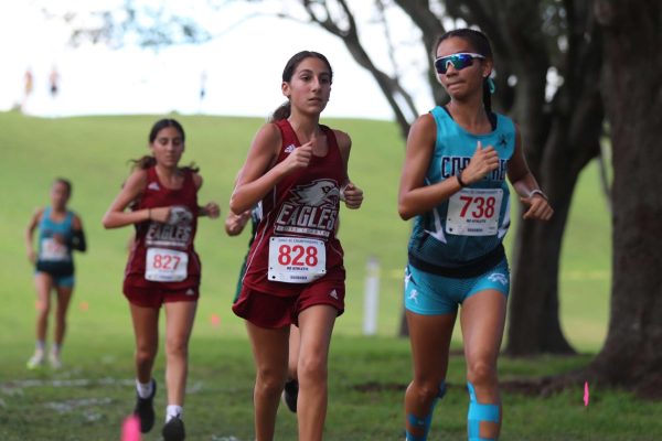 Junior Sparta Koumoutsakis races last season at a track meet. This year she improved her times after being on the team for three seasons; she even competed in states in Tallahassee this year.