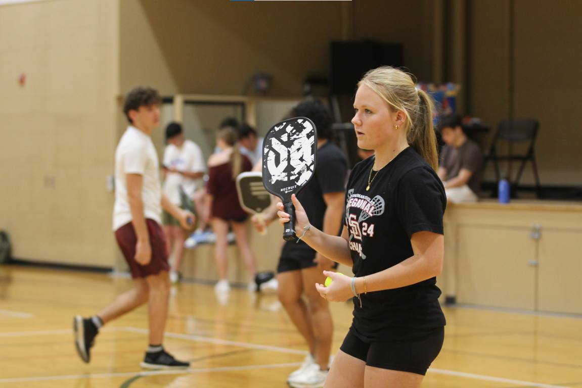 Junior Kaitlyn Irwin gets ready to serve the ball during the Fun4Funds pickleball event on Sunday, Jan. 12 at the Parkland Recreation Center. She lost her first match but won her second game in a different bracket. "Elle is my friend, and she's putting on this event and I wanted to support DECA," Irwin said. "I like pickleball a lot."