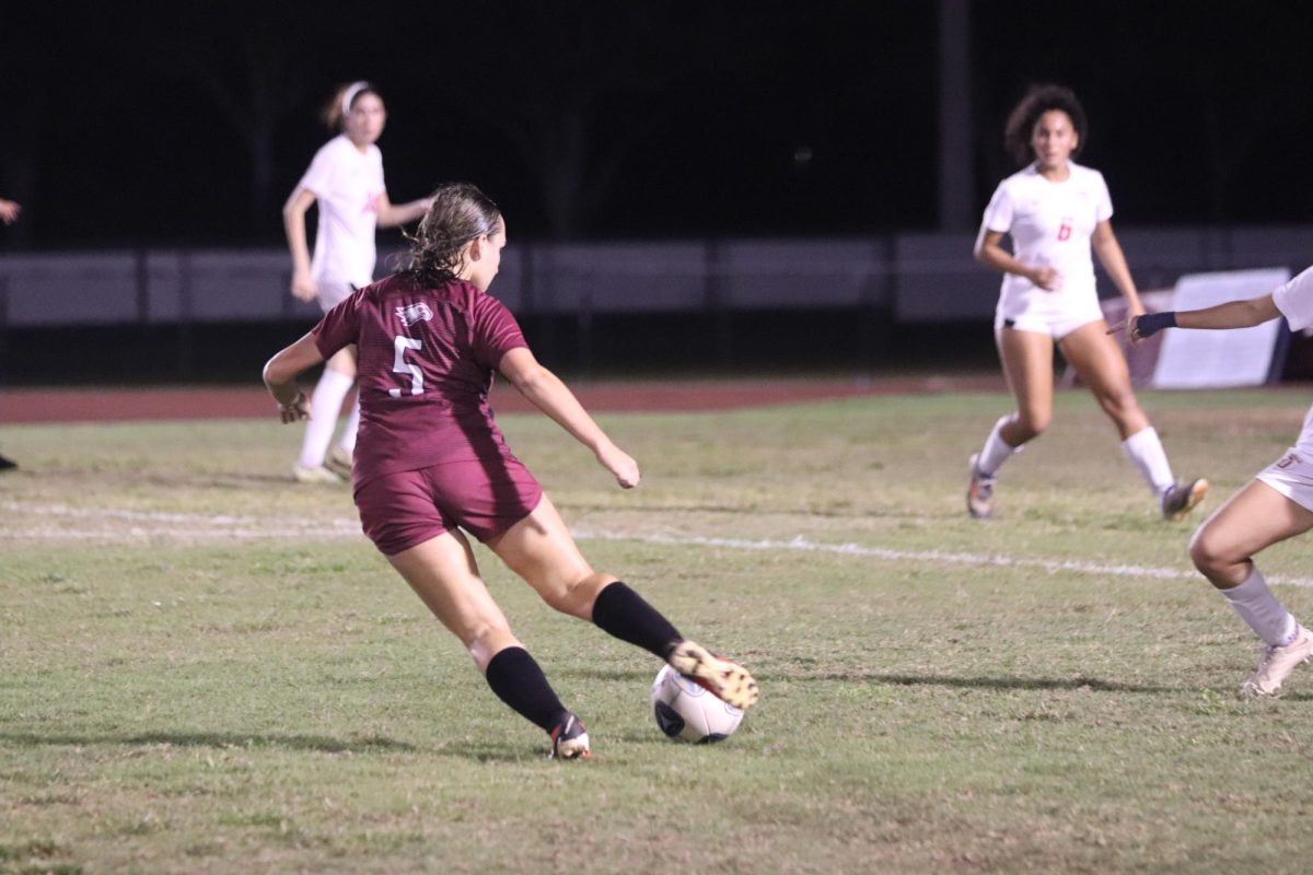 Midfielder Emily Rodriguez (5) passes the ball during the first half of the MSD women's varsity soccer regional quarterfinals on Tuesday, Feb. 4. MSD ultimately beat Doral Academy Preparatory School 4-3 on penalty kicks after a scoreless game and extra time. 