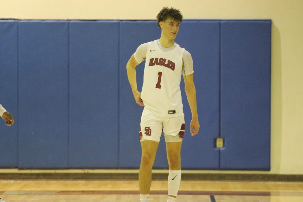 Shooting guard Brady Kuebler (1) talks with his teammates. The Eagles hosted their Senior Night on Monday, Jan. 27, and won their game, bumping their regular season record to 9-12; the Eagles will continue to districts as the fifth seed.