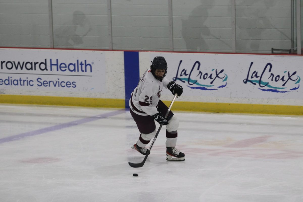 Forward Micheal Rozenblat (29) takes the puck into the defensive zone before getting a penalty for slashing. The Eagles 1 hockey team played the Westfield Mutts and secured a 6-5 victory. “We gotta come out better in the first,” Rozenblat said. “The starts we’ve been having have not been good."