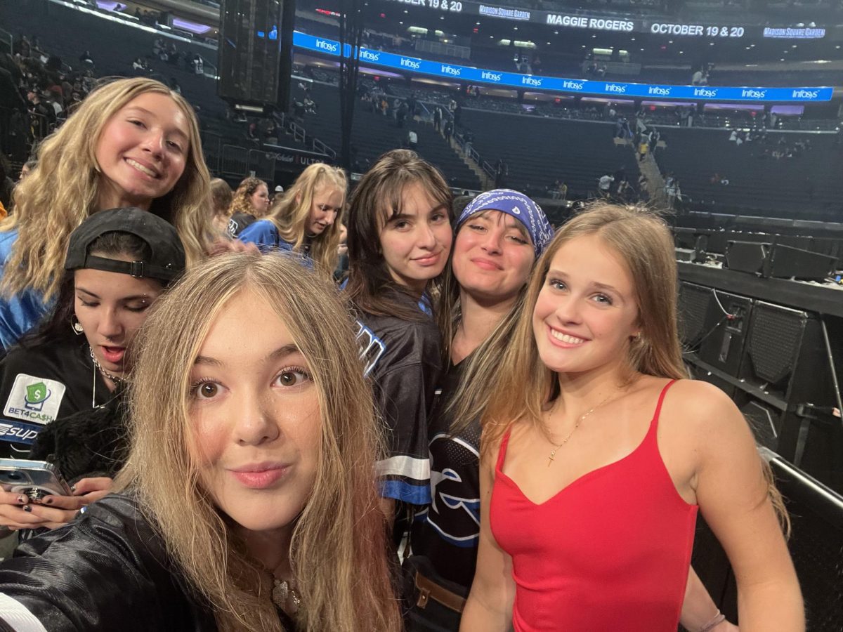 Standing with her online friends, sophomore Alexandria Sundquist takes a selfie at Billie Eilish's Hit Me Hard and Soft Tour on Thursday, Oct. 17. Sundquist camped outside the venue beginning at 4 a.m. to get front row seats. "This show was my first time being front row for Billie, which was incredibly meaningful and special since I had been looking up to her since I was a little kid," Sundquist said. Photo permission from Alexandria Sundquist.