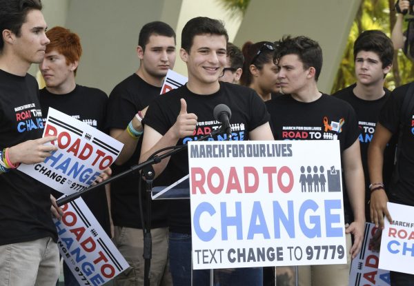 Former student Cameron Kasky gives a thumbs up after announcing in 2018 that the students of March for Our Lives would make stops across America to get young people educated, registered and motivated to vote on the Road to Change tour. Kasky is now running for Congress to represent New York’s 12th Congressional District of Manhattan. Photo permission from Taimy Alvarez/South Florida Sun Sentinel/TNS.