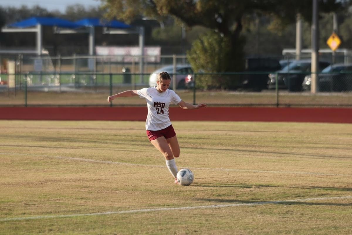 Kickin' It. Fullback Courtney Heymach (24) sets up to clear the ball against Cypress Bay High School on Wed., Feb. 11. Heymach played well, clearing many of Cypress Bay's attacks. 